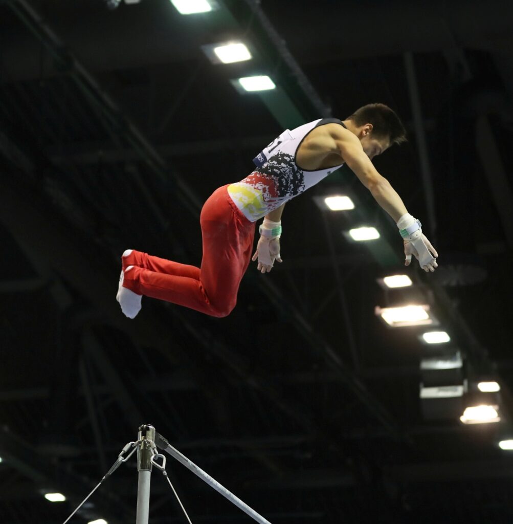 Gymnast Wearing ReichelSport Grips on High Bar