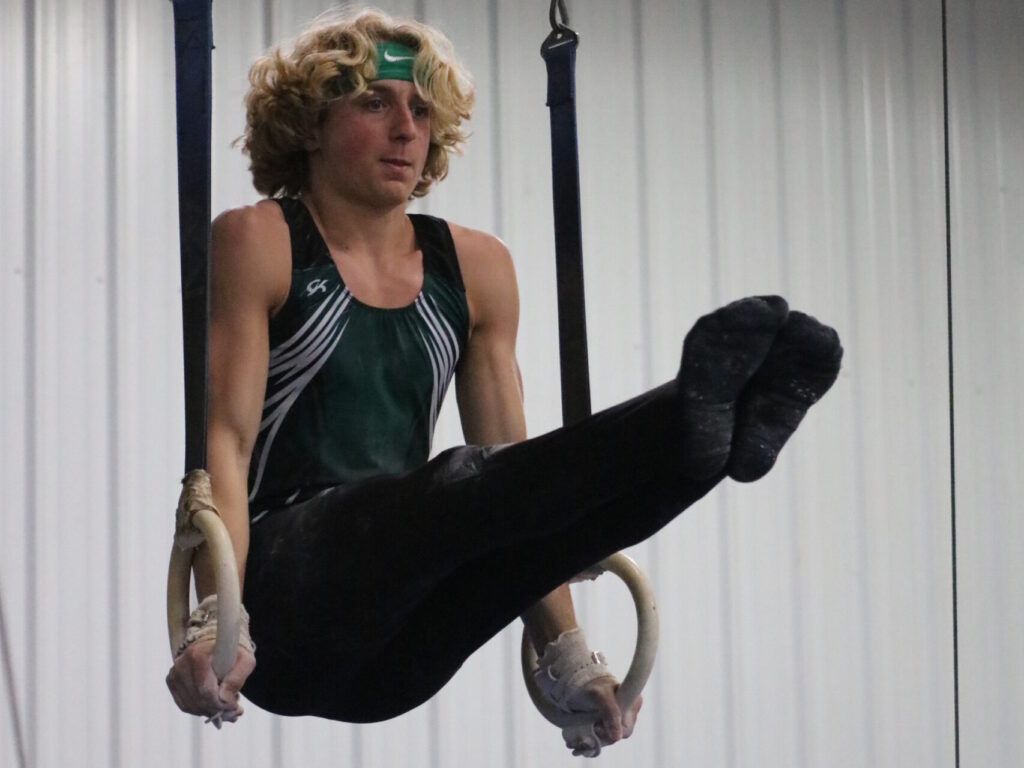 Gymnast Performing L-Sit on Still Rings